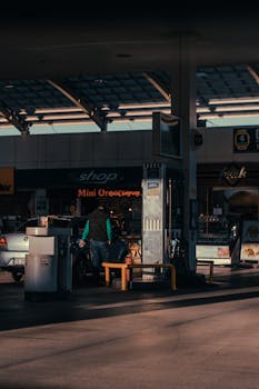 Man refueling car at a petrol station in İstanbul during the day.