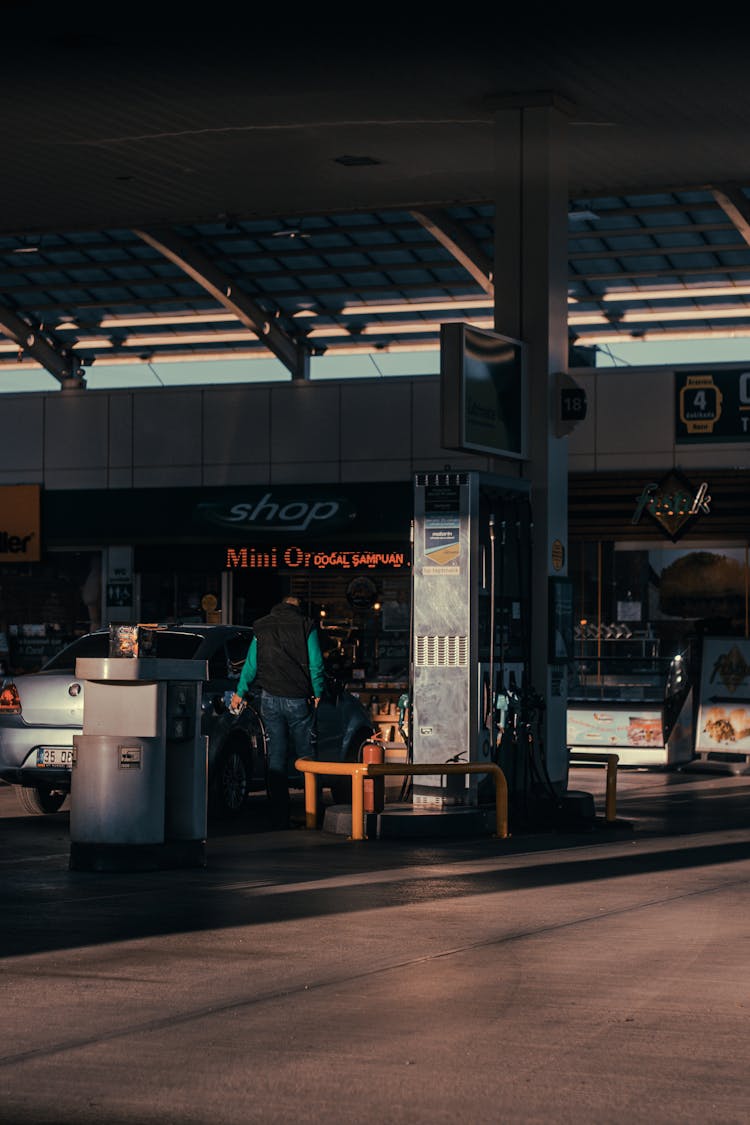 Man Filling Up A Vehicle With Gas