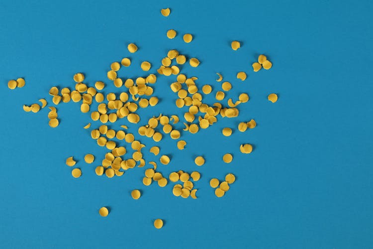 Yellow Confetti On Blue Surface