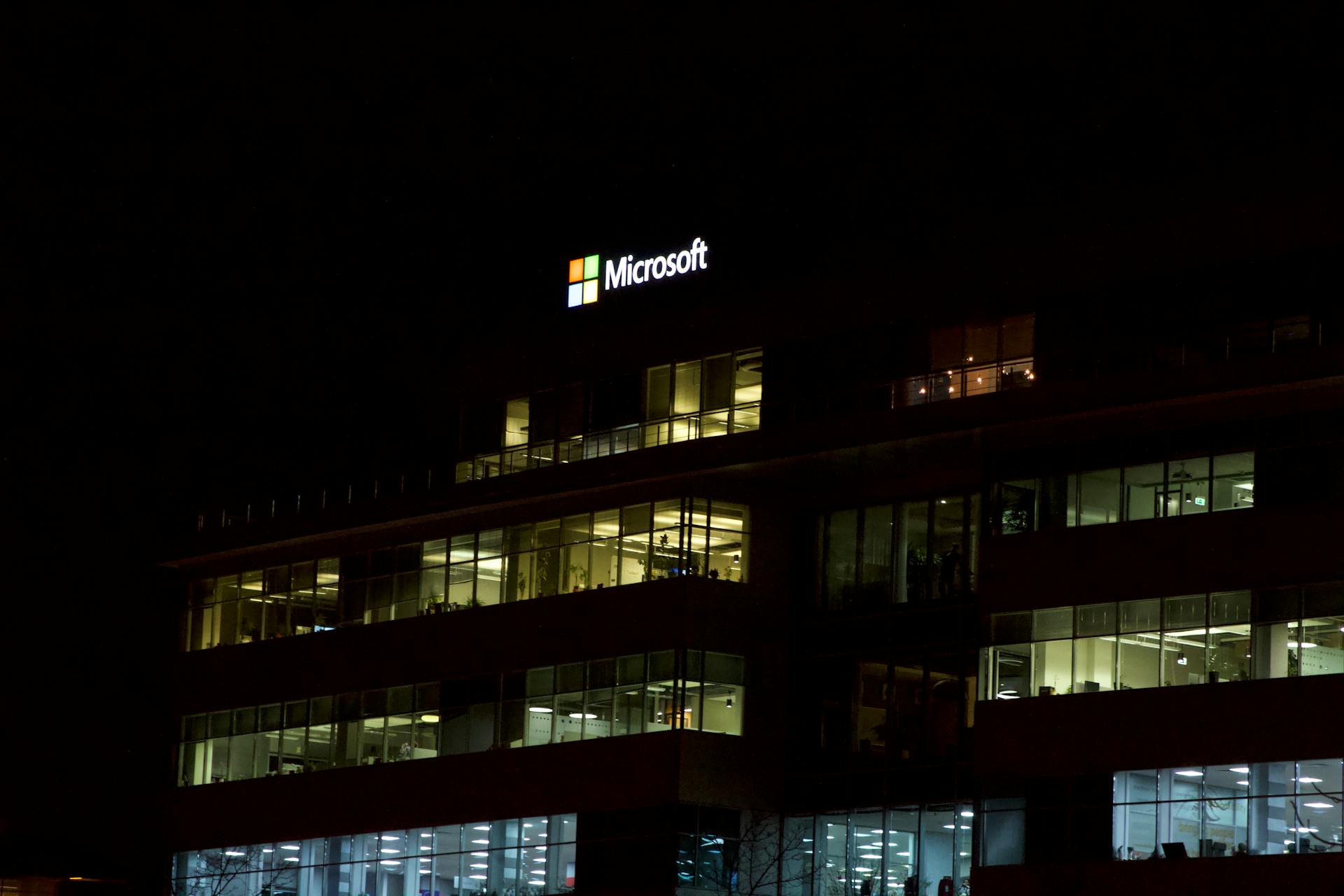 Modern office building with lights in windows at night