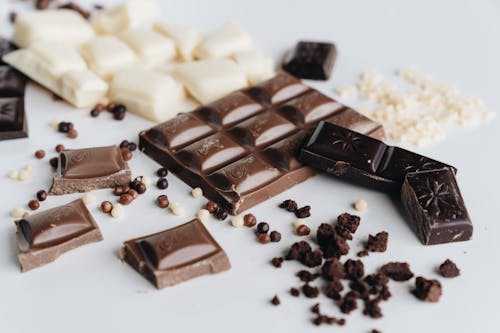 Free Chocolate Bars on a White Surface Stock Photo