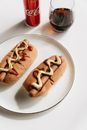American Style Hot Dogs on a Plate and a Can of Coca-Cola 