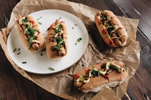 Tasty hot dogs with toppings on a plate, perfect fast food meal.