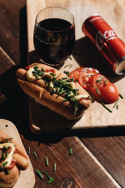 Free Hot Dogs on Wooden Board and Coca Cola  Stock Photo