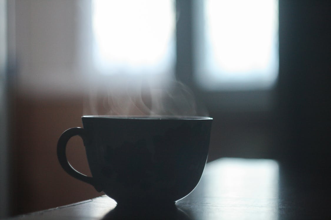 Free Black Ceramic Cup With Smoke Above Stock Photo