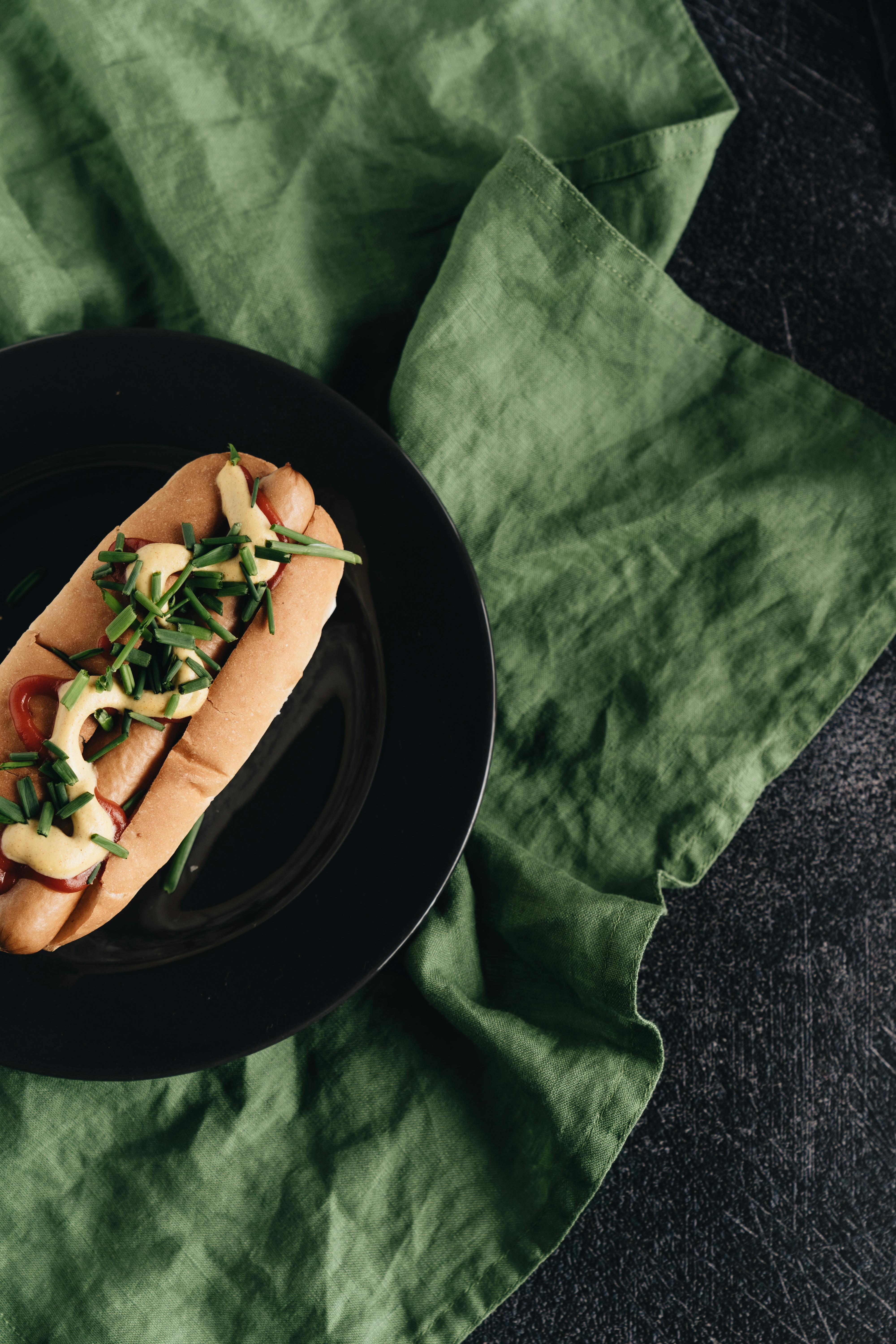 hot dog on black ceramic plate