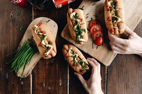 Hot Dogs on Wooden Board 