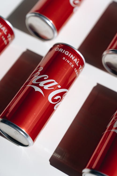 Cans of Coca-Cola Lying Symmetrically 