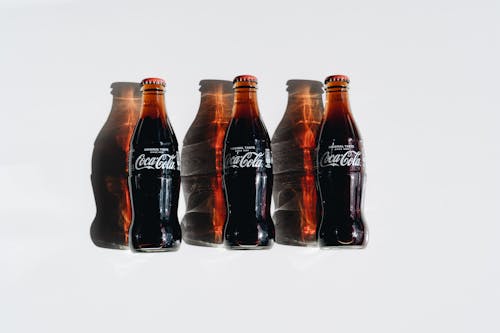 Free Coca Cola Zero Bottles on White Table Stock Photo