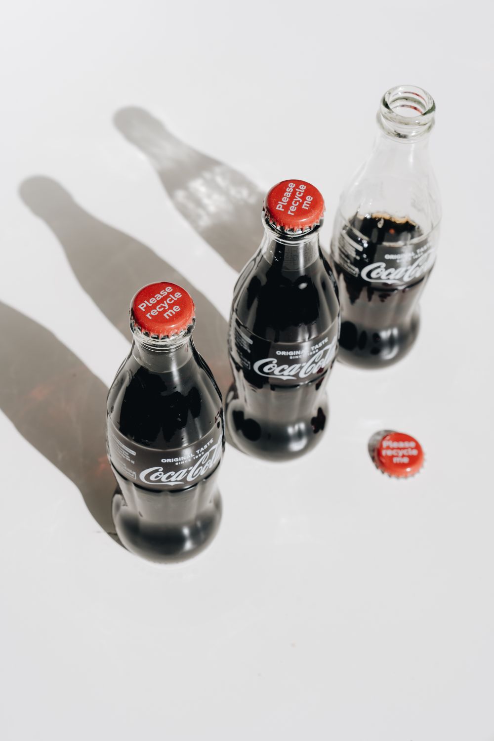 Coca Cola Zero Bottles on White Table · Free Stock Photo