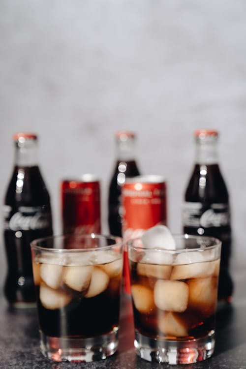 Free Coca Cola in Glasses and Bottles Stock Photo