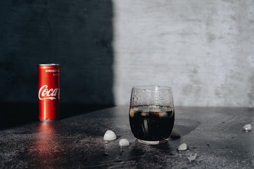 Coca-Cola with Ice Poured into a Glass 