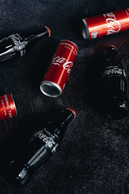 Free Coca-Cola in Cans and Glass Bottles Stock Photo
