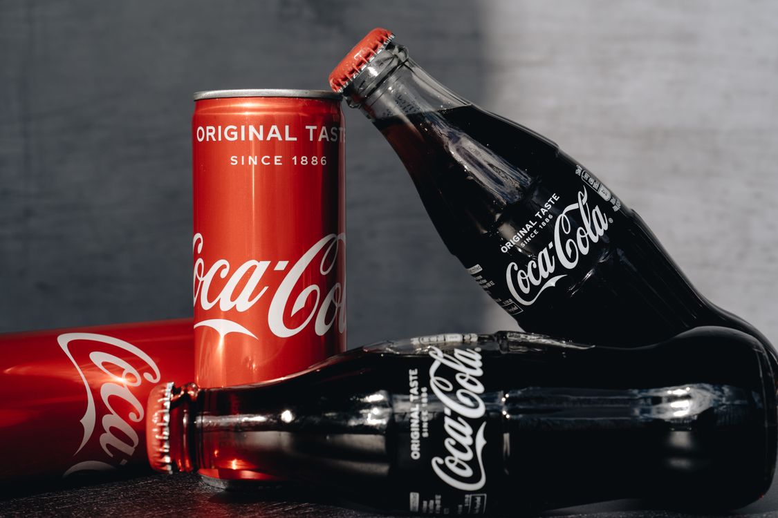 Glass Bottles And Cans Of Cola Free Stock Photo glass-bottles-and-cans-of-cola-free-stock-photo