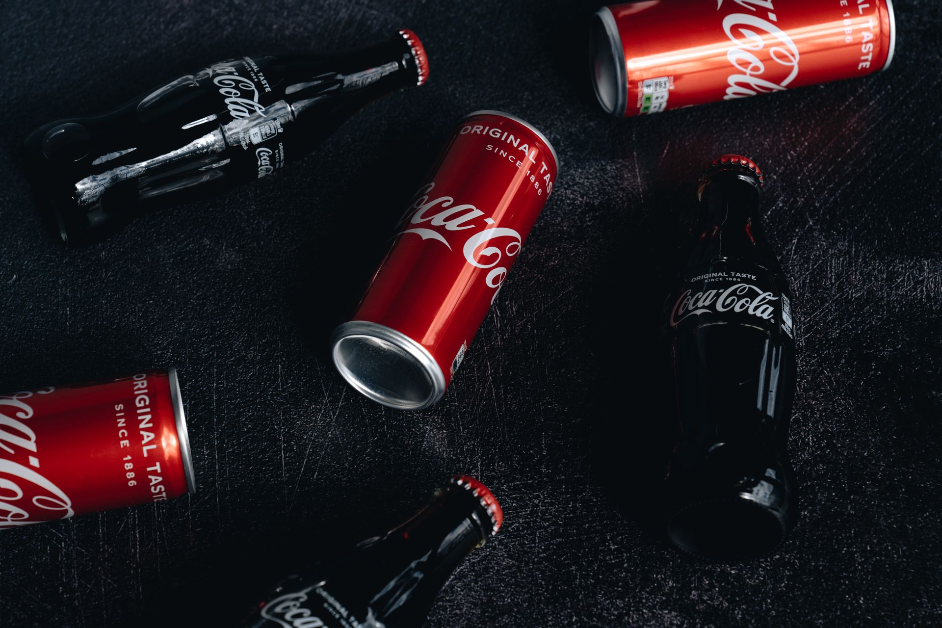 Close-Up Photo Of Canned And Bottled Soft Drinks