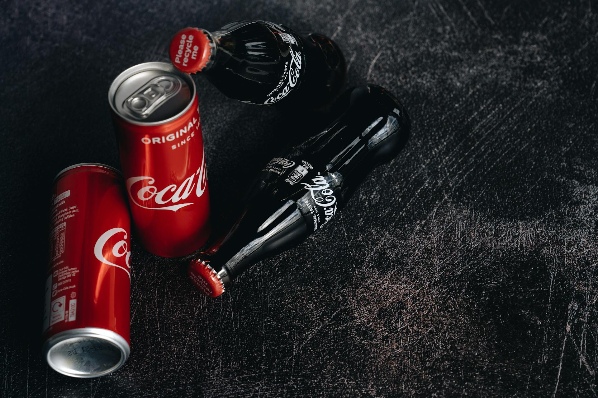 Close-Up Photo Of Canned and Bottle Soft Drinks