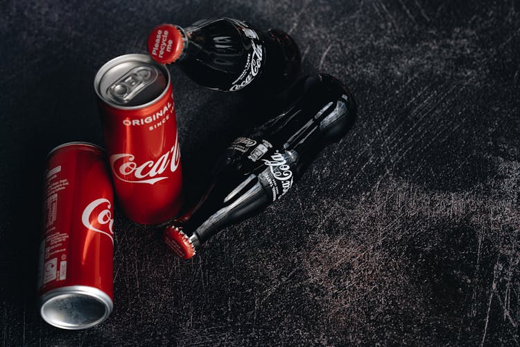 Close-Up Photo Of Canned And Bottle Soft Drinks