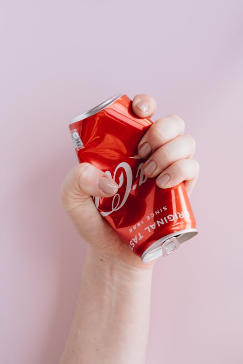 Free Photo Of Person Holding Can Stock Photo