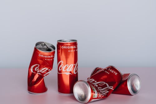 Free Coca Cola Can on White Table Stock Photo