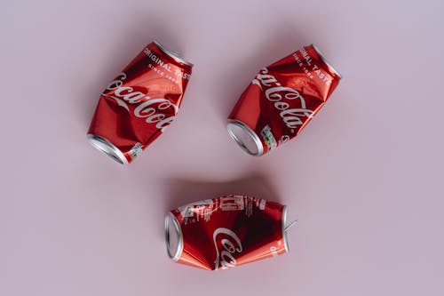 Photo Of Red Crumpled Cans