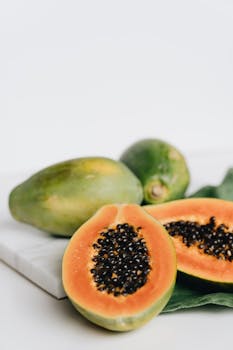 Close-up of ripe papaya slices showcasing vibrant colors and seeds, perfect for healthy eating and tropical cuisine.