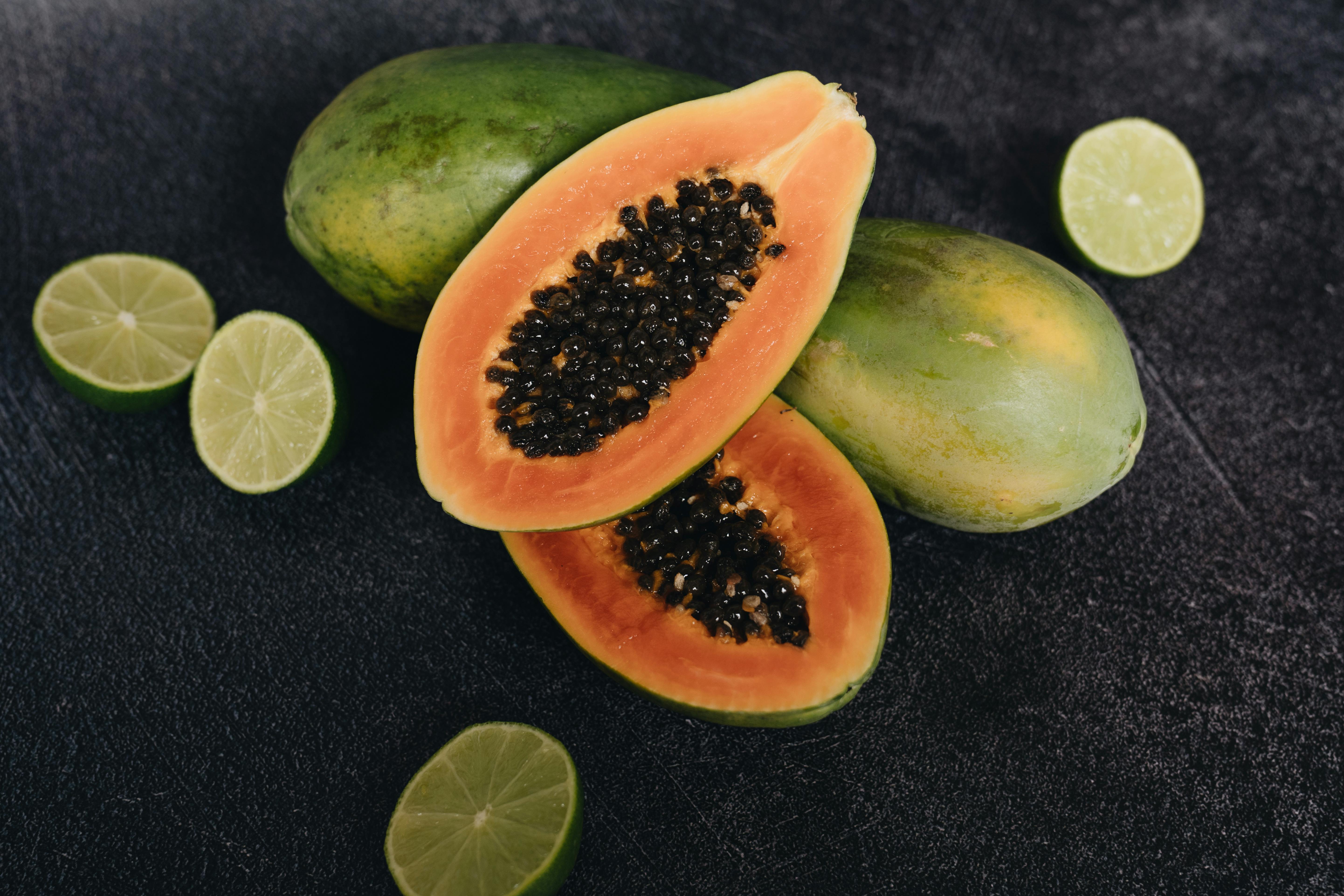 Photo Of Papaya Beside Sliced Lime · Free Stock Photo