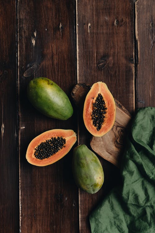 Free Photo Of Sliced Papaya On Top Of Wooden Surface Stock Photo