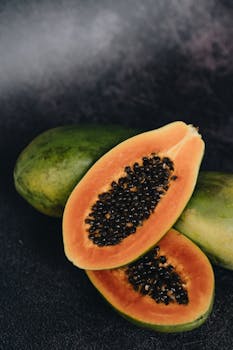 A vibrant sliced papaya showcasing its rich orange color and seeds, perfect for a healthy lifestyle concept.