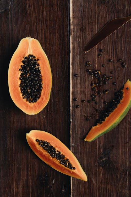 Free Photo Of Papaya On Top Of Wooden Surface Stock Photo