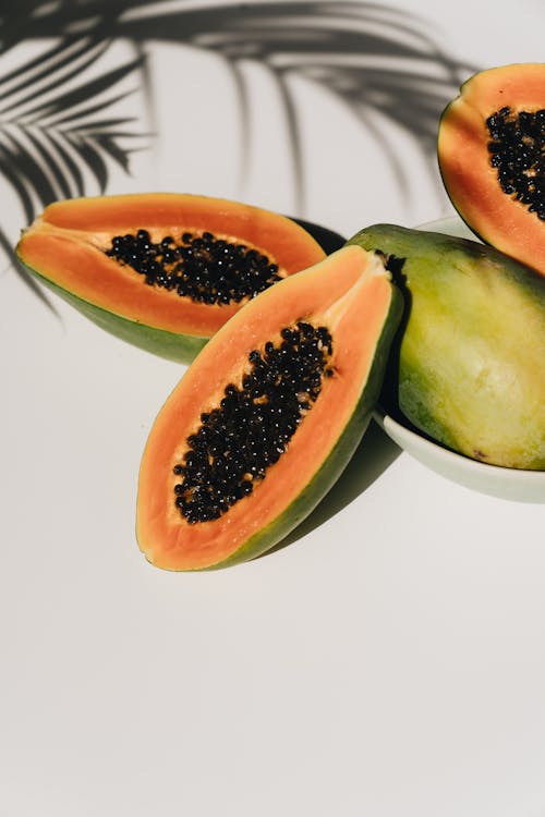 Free Fresh ripe papaya on white table Stock Photo
