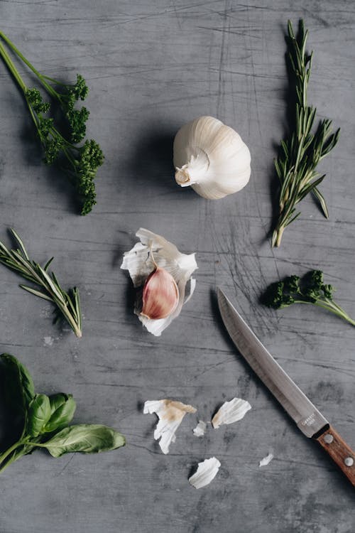 Photo Of Knife Near Garlic