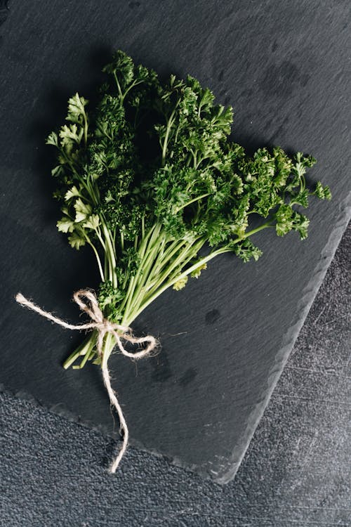 Photo Of Parsley On Top Of Stone Surface