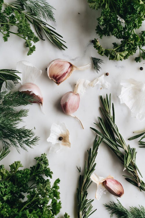 Free Close-Up Photo Of Garlic Near Herbs Stock Photo