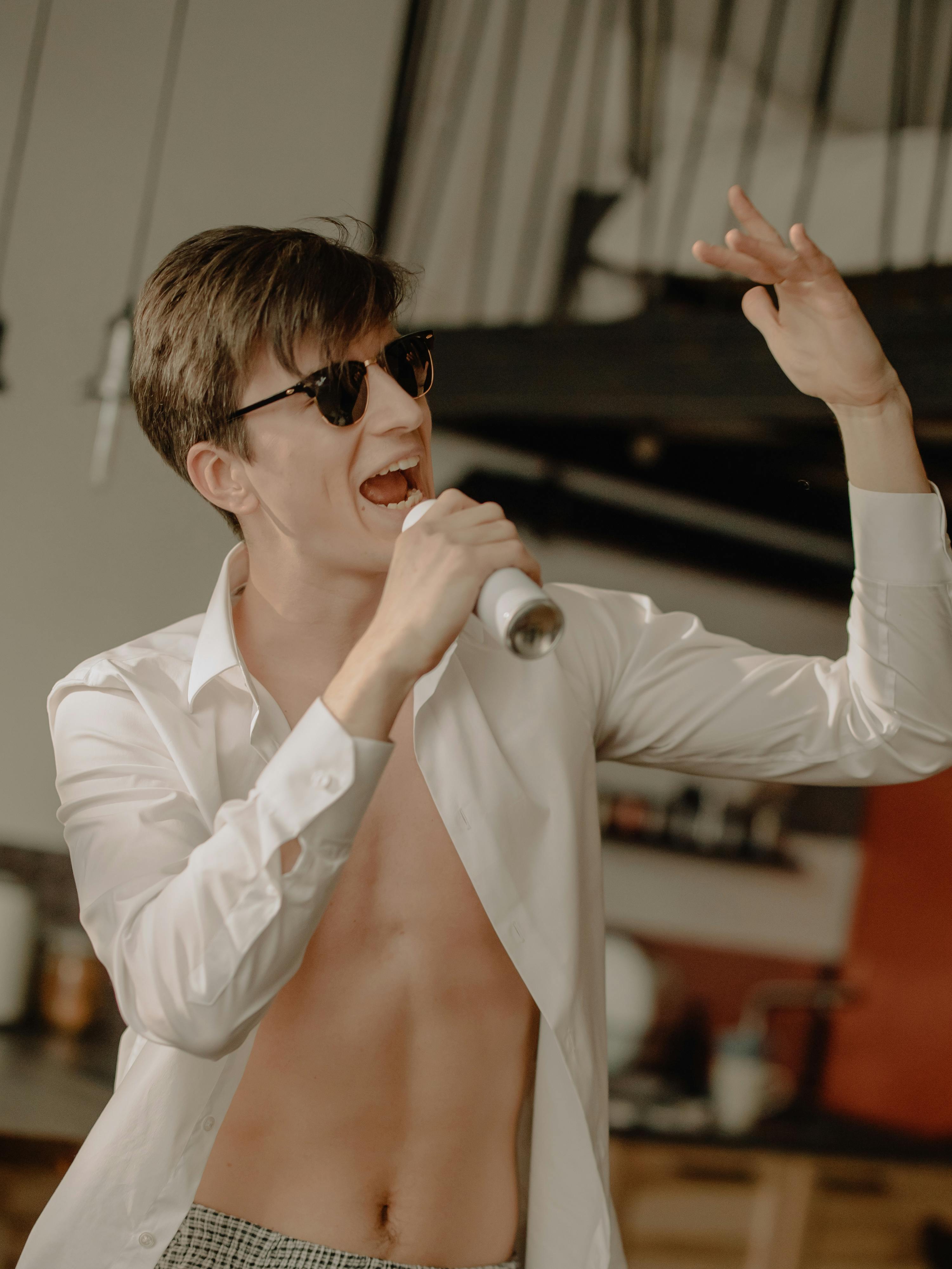 woman in white blazer wearing black sunglasses