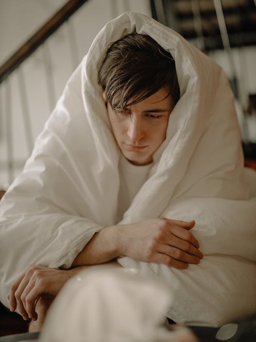 Free Woman in White Hijab Covering Her Face With White Blanket Stock Photo