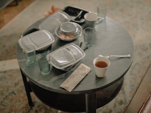 White Ceramic Bowl on Black Wooden Table