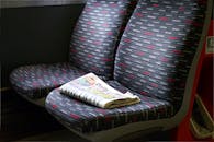 Bus Seat with Newspaper