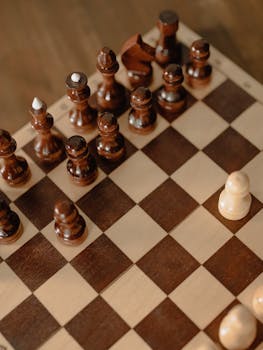 Close-up of a classic wooden chess board with detailed pieces, perfect for leisure at home.