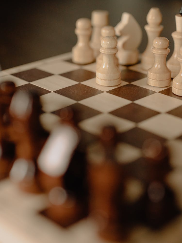 White Chess Piece On Chess Board