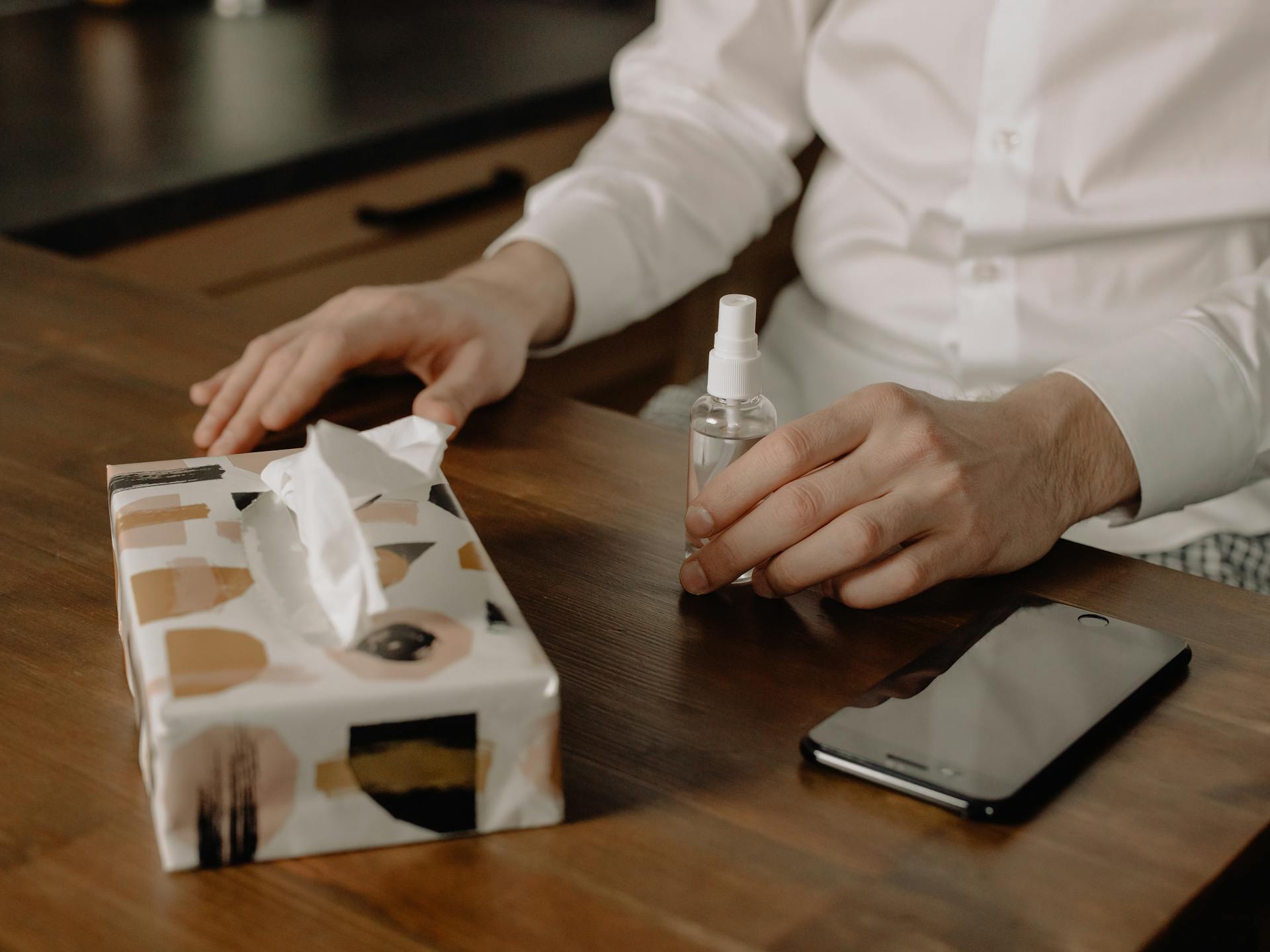 Person Holding White Plastic Pack