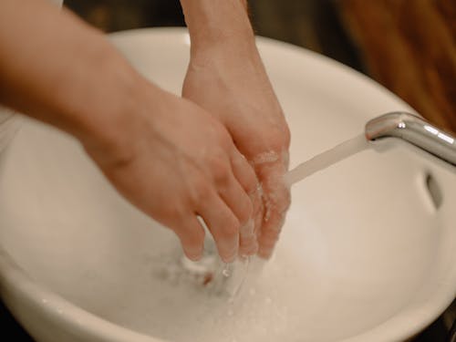 Person Washing Hands