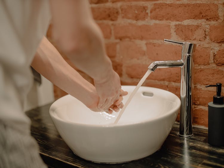 Person Washing Hands