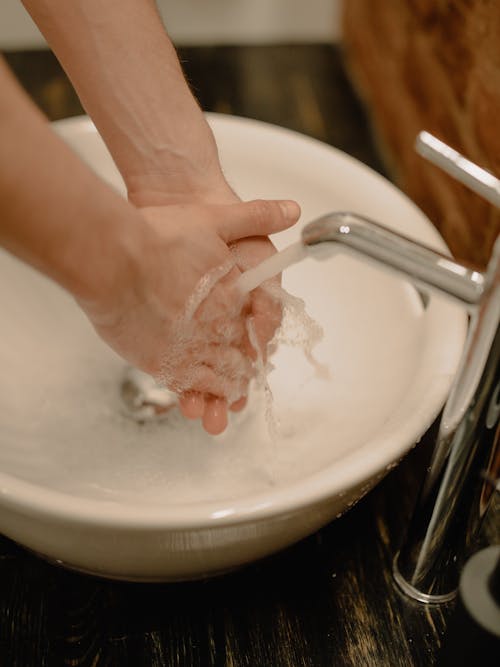 Person Washing Hands