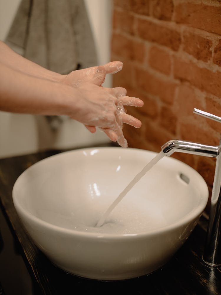 Person Washing Hands