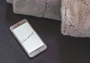 IPhone with a Lockscreen Saying Pause and Reset
