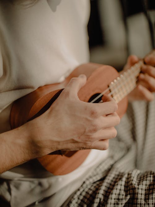 Free Person Playing Brown Acoustic Guitar Stock Photo