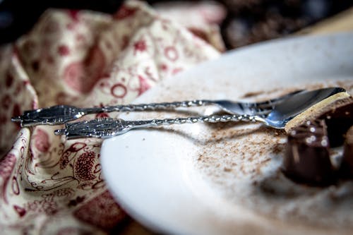 Free Classic Silver Fork and Spoon on White Ceramic Plate Stock Photo