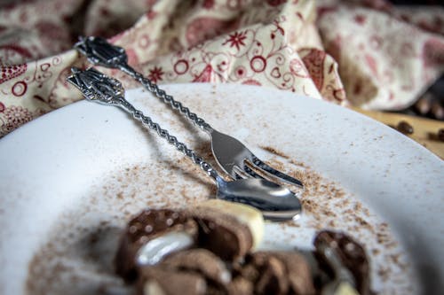 Free Silver Spoon and Fork on White Ceramic Plate Stock Photo