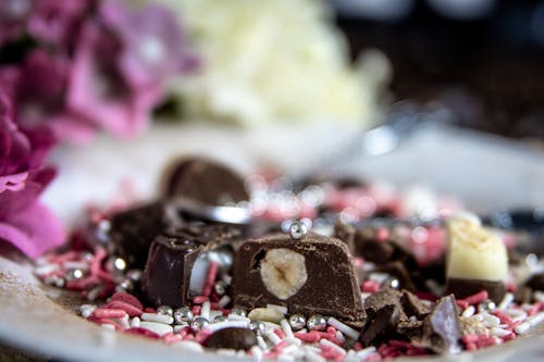 Milk Chocolate Bars with Sprinkles on Ceramic Plate