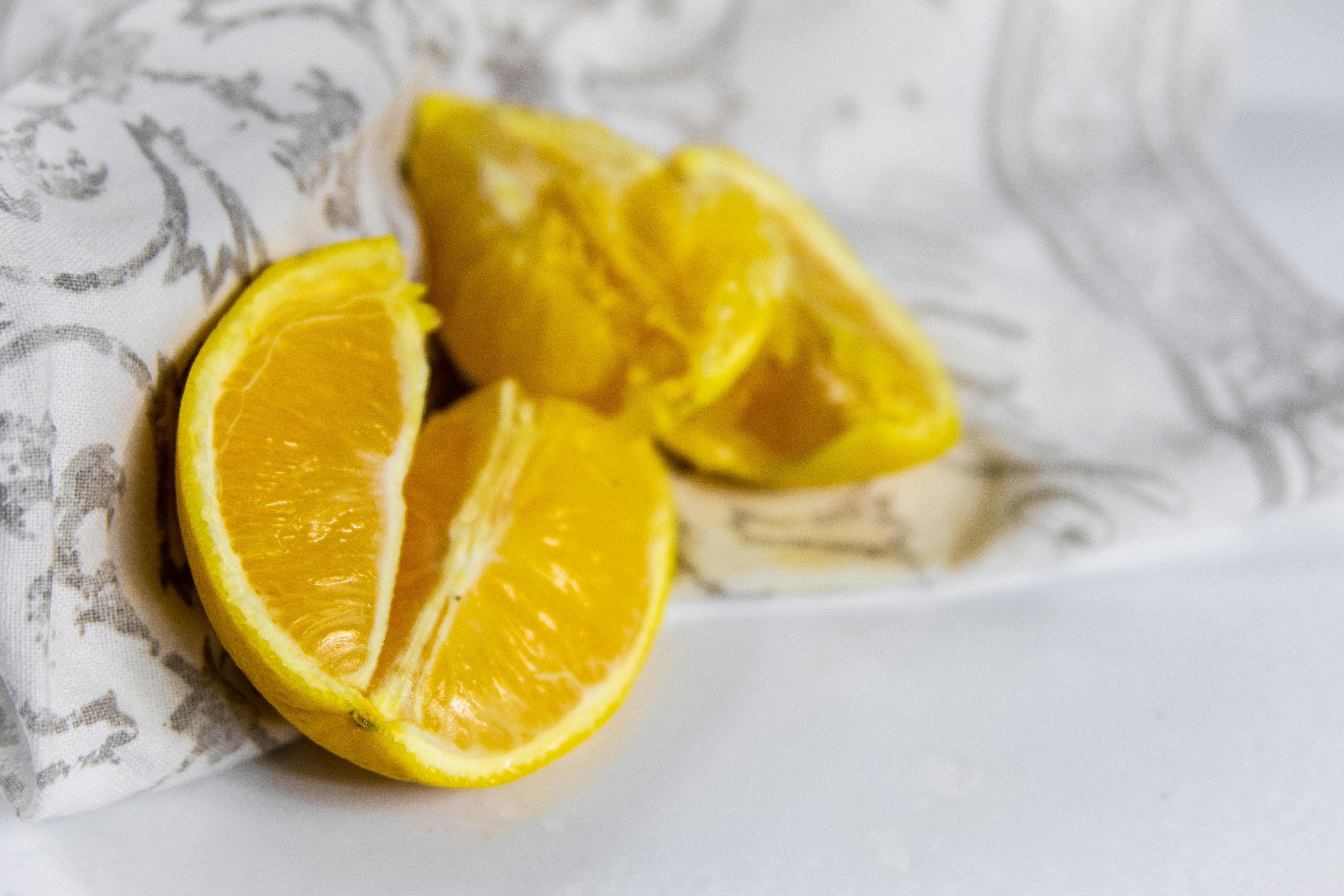 sliced lemon on white ceramic plate